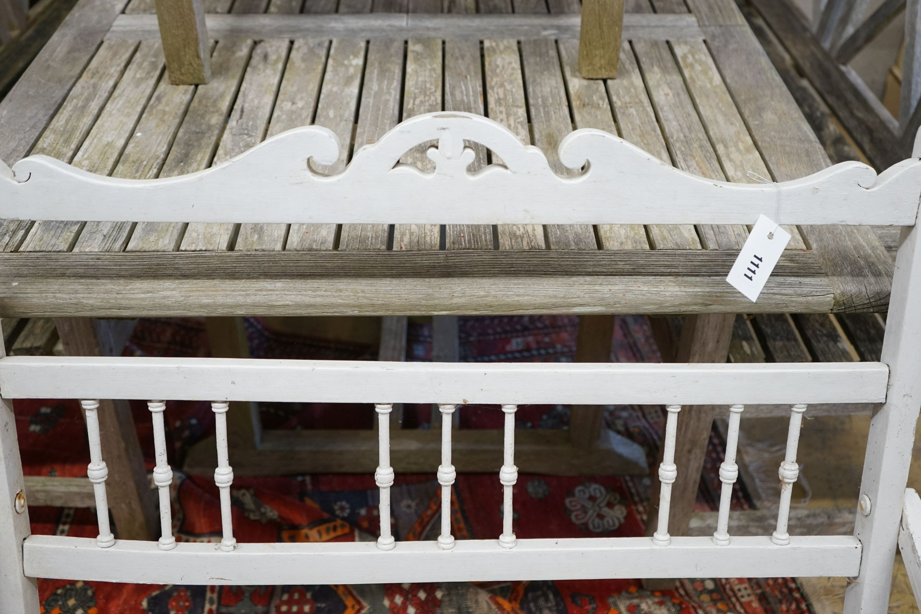 A painted slatted wood folding garden bench, length 97cm, depth 58cm, height 90cm